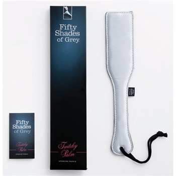 Fifty Shades of Grey Twitchy Palm Spank Paddle Packaging Shot with box, paddle and instruction manua