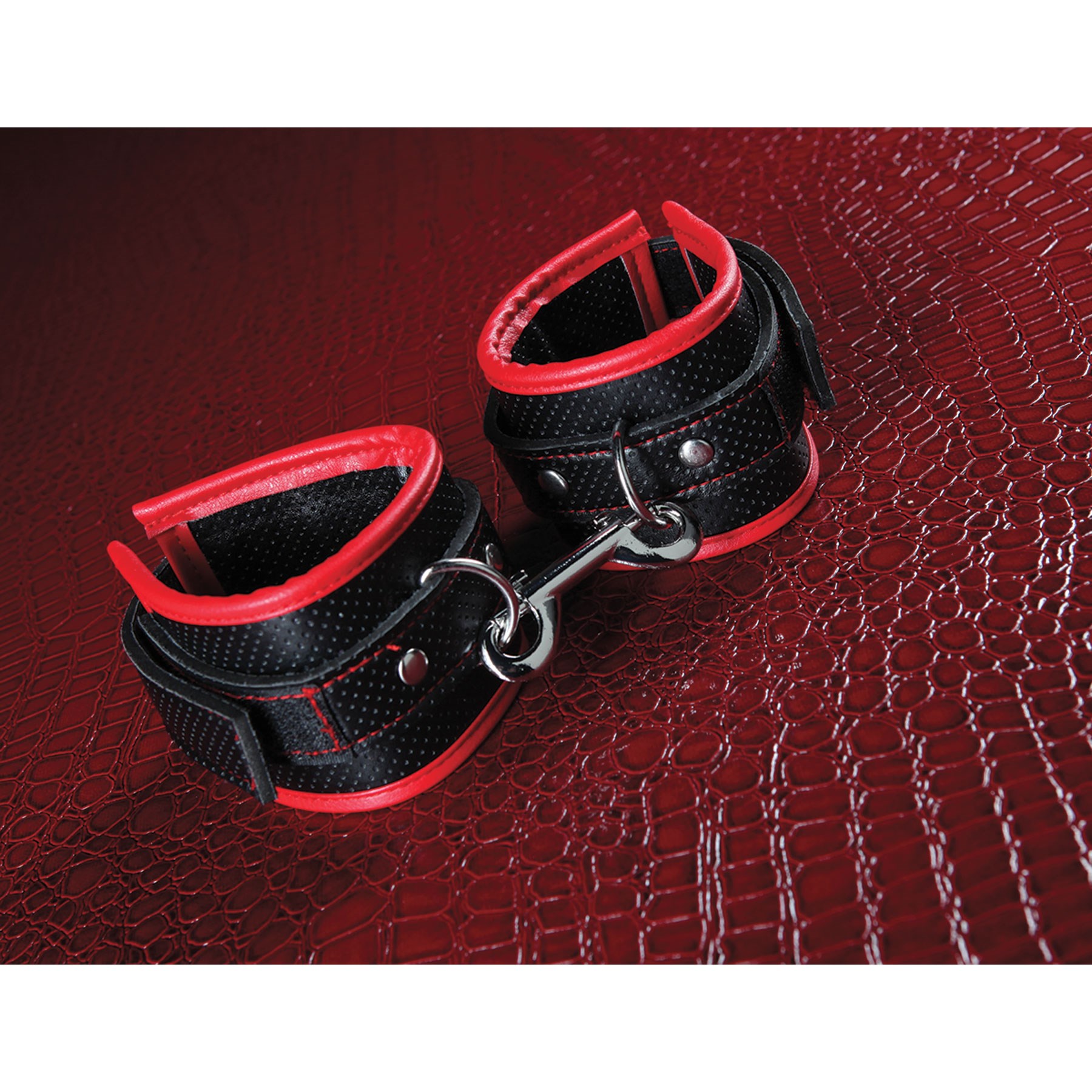 A&E's Scarlet Bound To Surrender Cuffs with cuffs on red background 