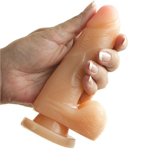 X5 5 Inch Dildo with Suction Cup hand holding for scale