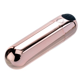 Rosy Gold Rechargeable Bullet  laying on table