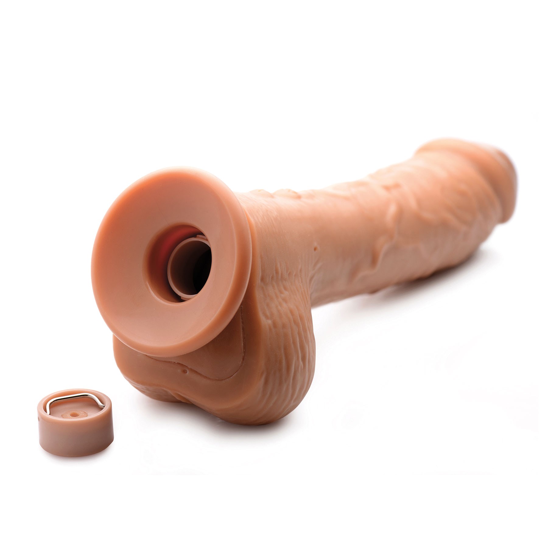 Loadz Vibrating Squirting Dildo brown version on table with end cap removed