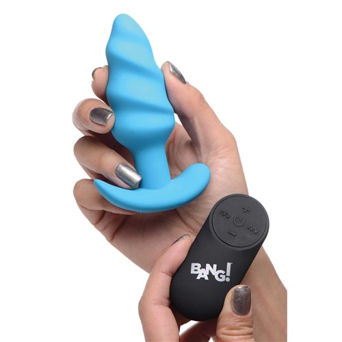 21X vibrating silicone swirl butt plug hand shot with remote