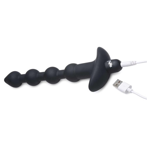 remote control vibrating silicone anal beads with USB charging cable inserted into charging port