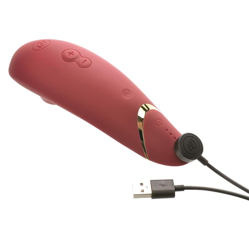 Womanizer Premium 2 Clitoral Stimulator Showing Where Charger is Placed - Red