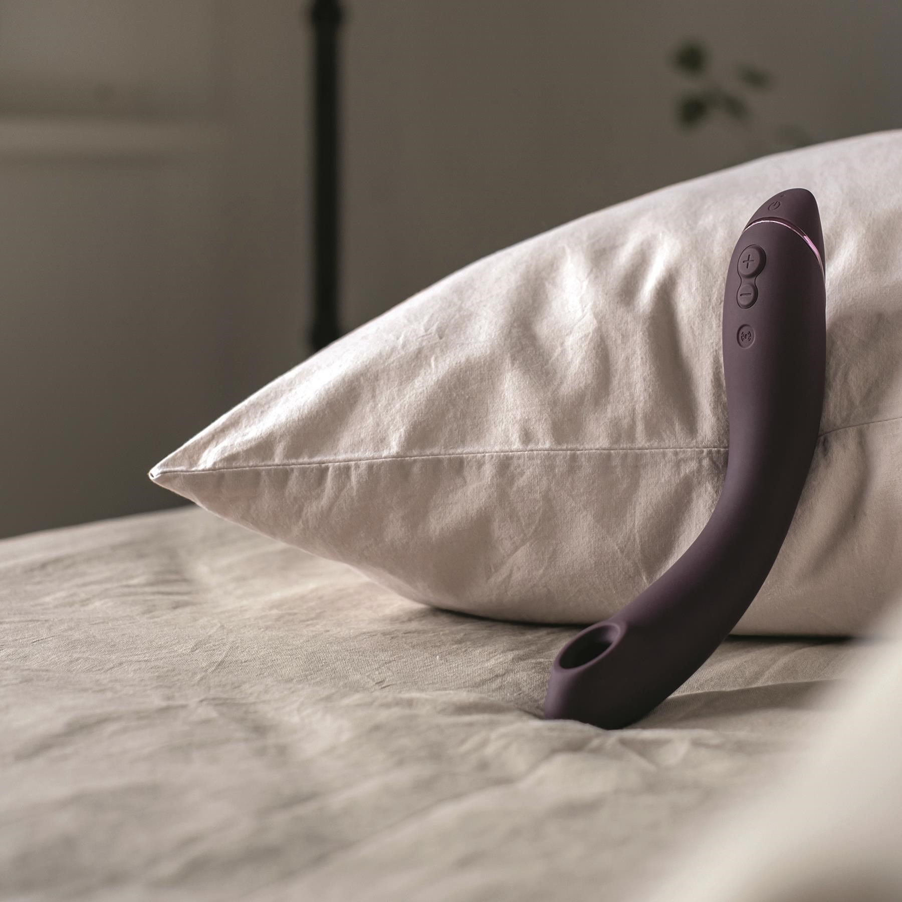 Womanizer OG Air Pleasure G-Spot Massager - Lifestyle Shot on Bed