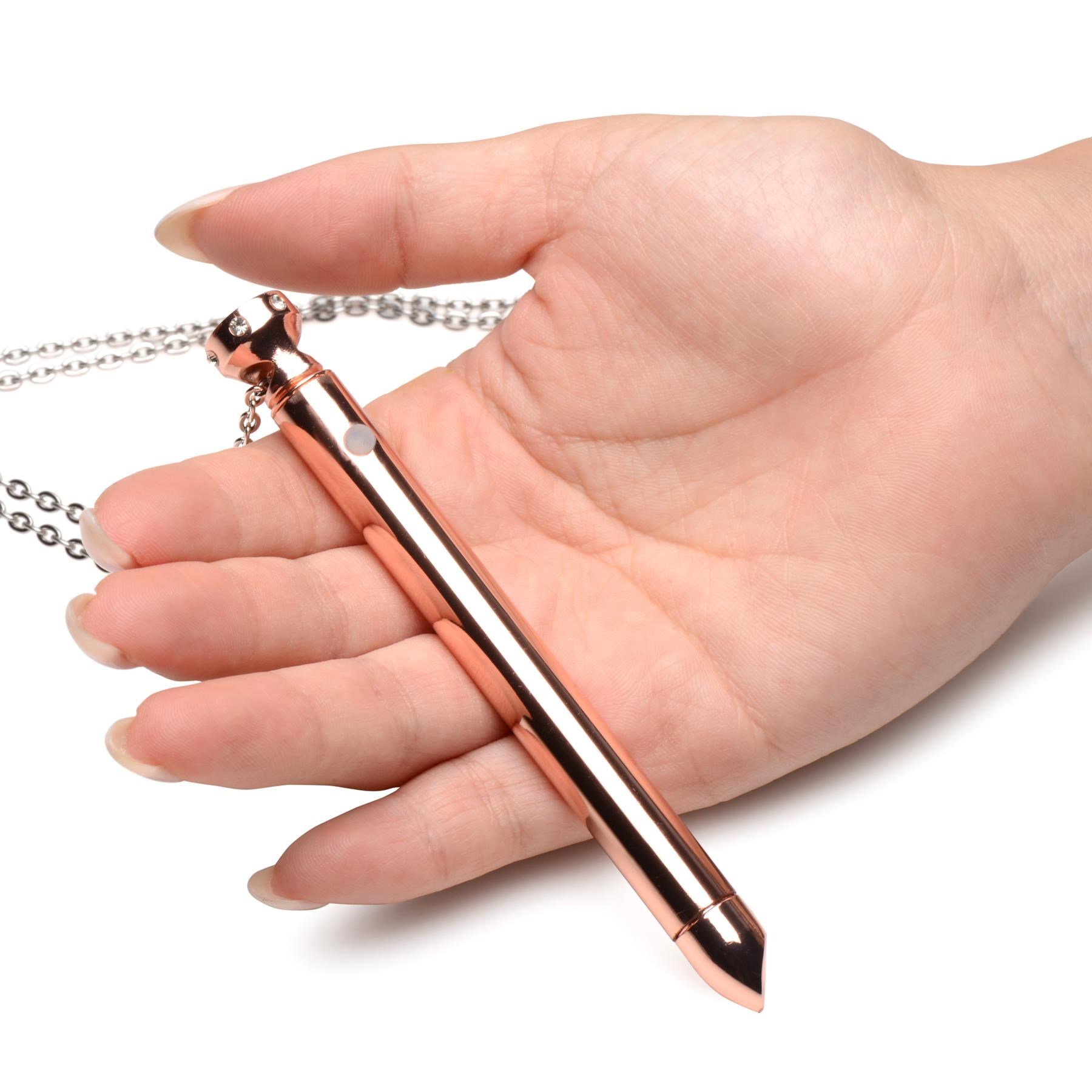 Charmed Vibrating Necklace - Product Shot - Rose Gold - Hand Shot