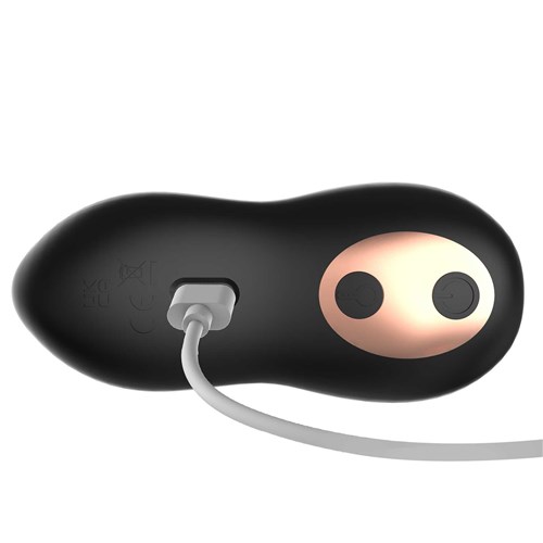 DEREK WARMING & ROTATING PROSTATE VIBE charger plugged into base