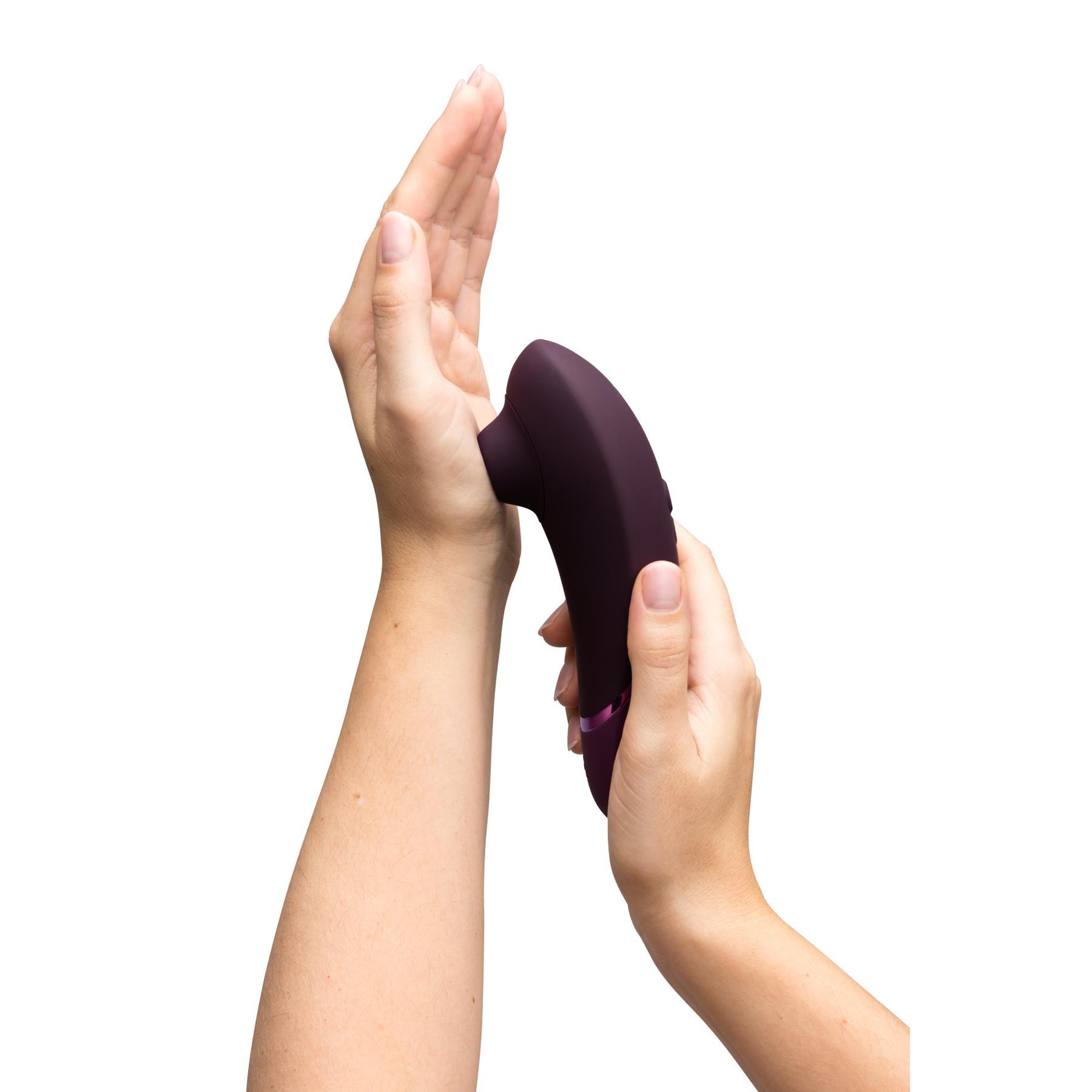 Womanizer Next Pleasure Air Clitoral Stimulator- Hand Shot to Show Size