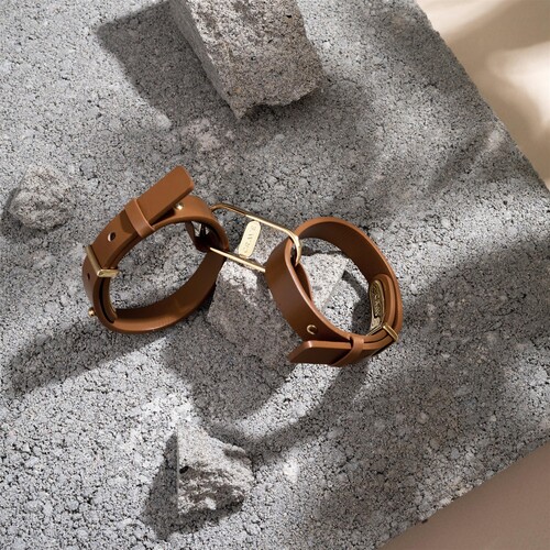 Crave Icon Leather Cuffs tan lifestyle shot 1