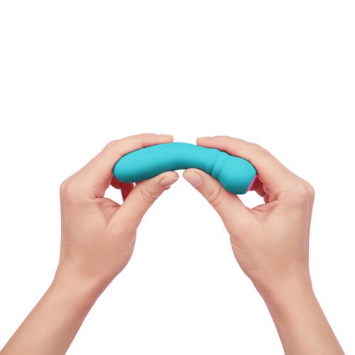 Femme Funn Ultra Bullet Massager turquoise in hand showing flexibility
