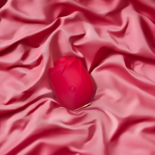Womanizer Pleasure Air Rose - Lifestyle Shot - On Satin Sheet