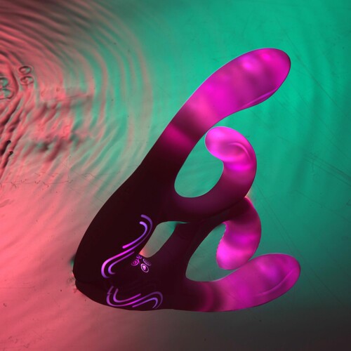 Illumination Rabbit Vibrator glowing resting in water