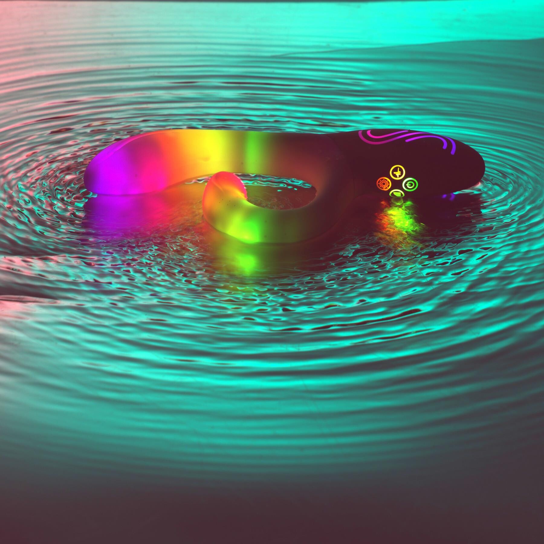 Illumination Rabbit Vibrator glowing resting in water