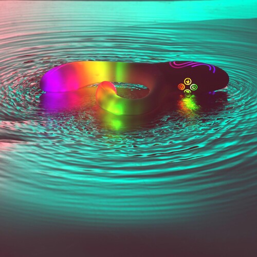 Illumination Rabbit Vibrator glowing resting in water