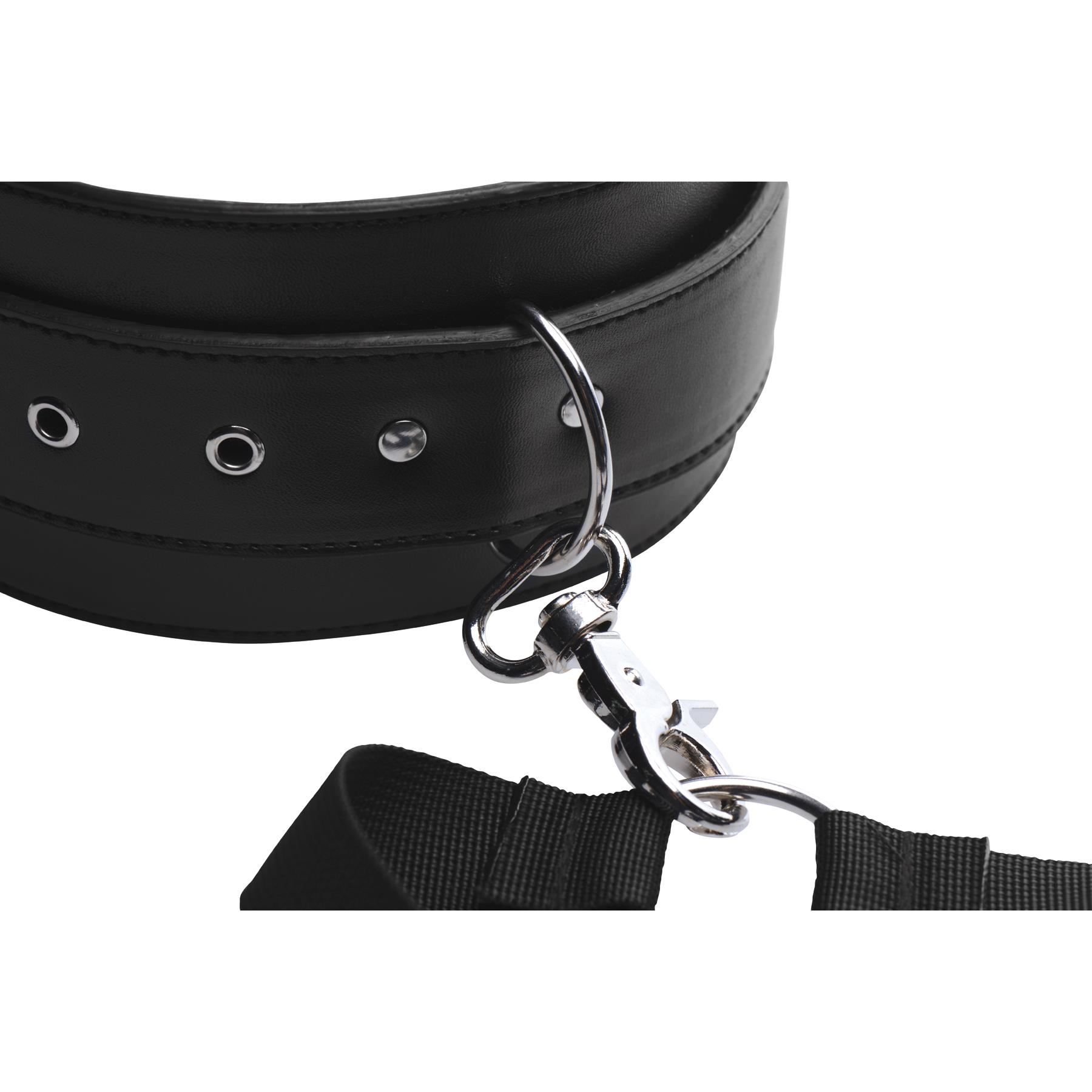 Master Series Acquire Thigh Harness With Wrist Cuffs showing cuff buckle