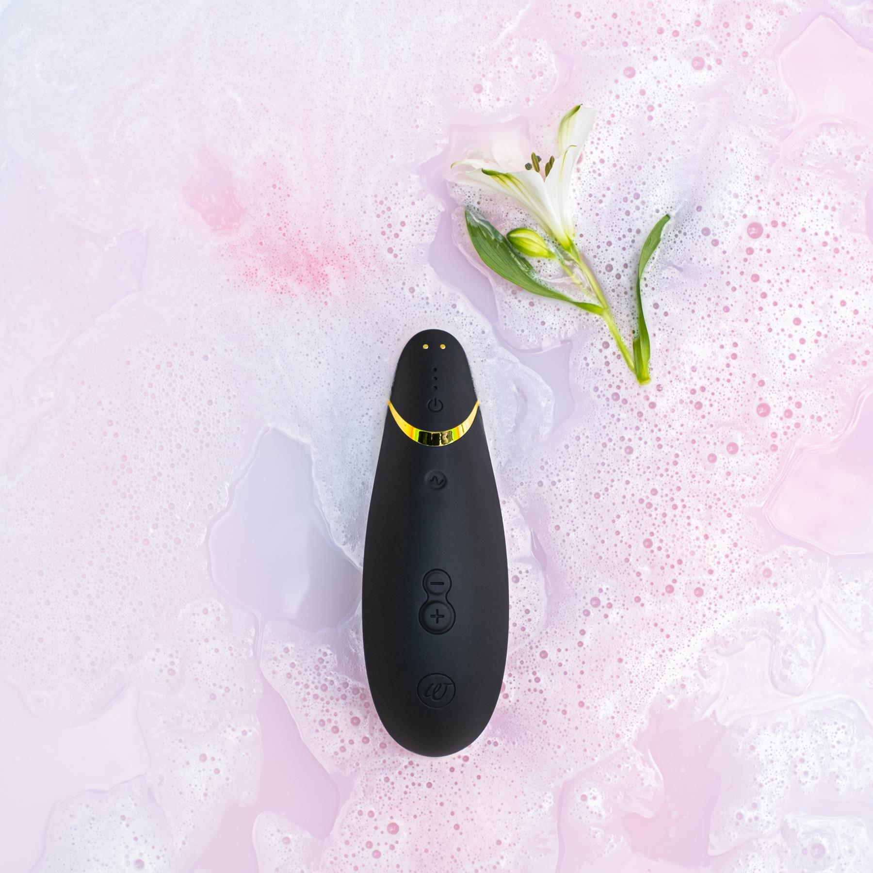 Womanizer Premium 2 Clitoral Stimulator - Black with moody background