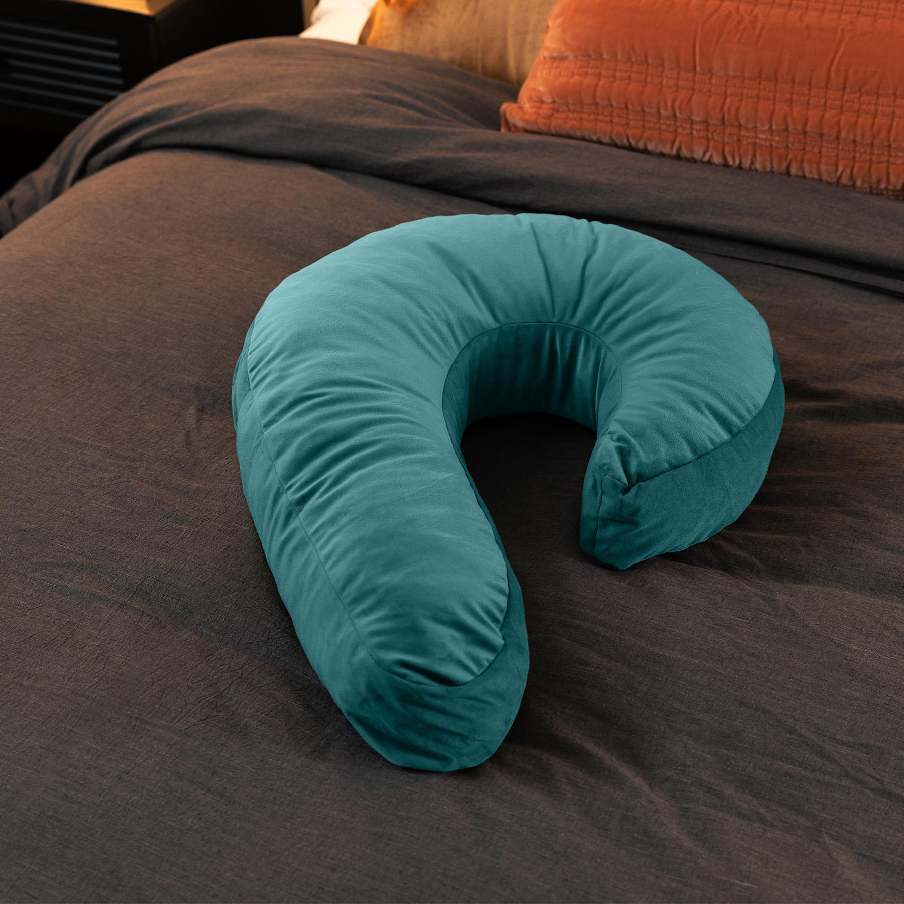 Liberator Side Snuggle Pillow color blue on bed