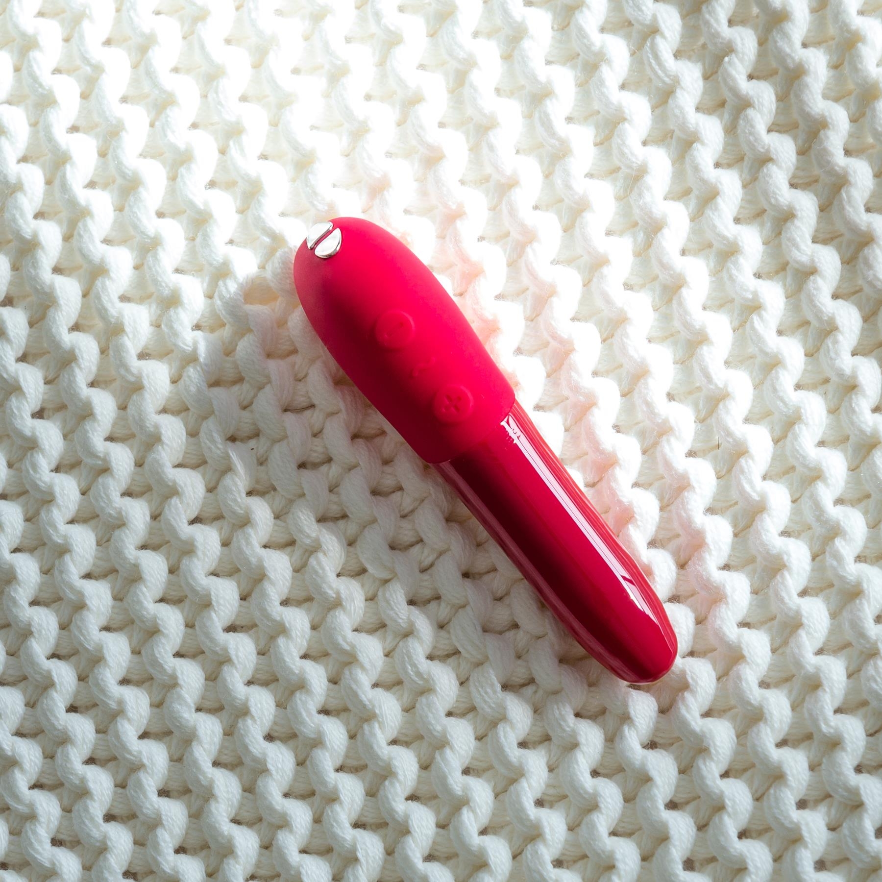 We-Vibe Tango X Bullet Vibrator laying flat color red