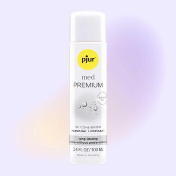 pjur med PREMIUM front of bottle with background color